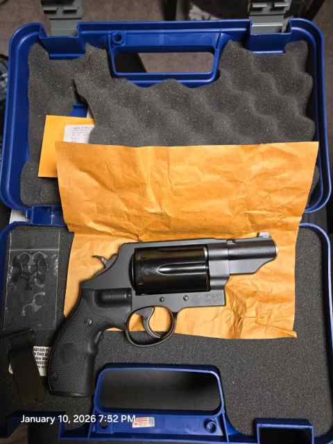 S&amp;W Governor with Crimson Trace laser grips.